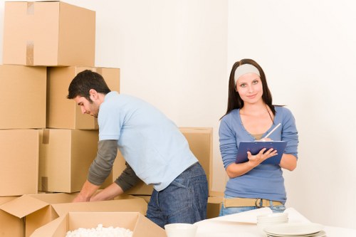 Professional team handling office equipment and desks during a Bethnalgreen move