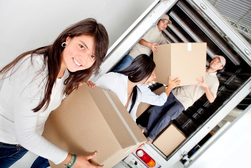Careful loading of office furniture during a Bethnalgreen business move