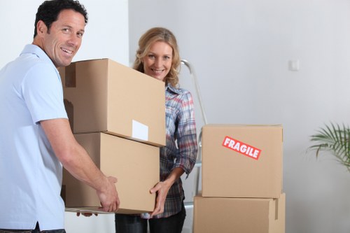 Professional office relocation team handling desks and equipment in East London